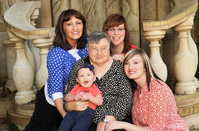 Grace Kendall poses with her family